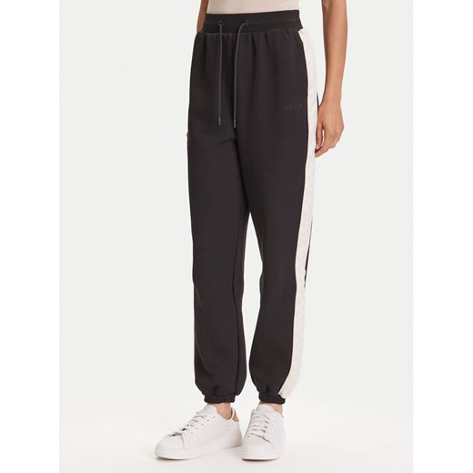 Guess Spodnie dresowe V5YB02 KB3P2 Czarny Regular Fit ze sklepu MODIVO w kategorii Spodnie damskie - zdjęcie 188412260