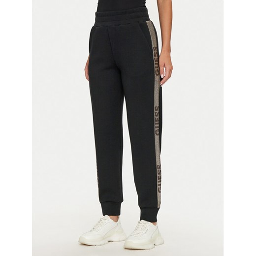 Guess Spodnie dresowe Logo W4YB40 KBYE2 Czarny Regular Fit ze sklepu MODIVO w kategorii Spodnie damskie - zdjęcie 188418932