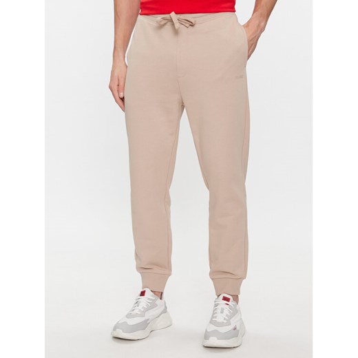 Hugo Spodnie dresowe Dayote232 50489617 Beżowy Regular Fit ze sklepu MODIVO w kategorii Spodnie męskie - zdjęcie 188419302