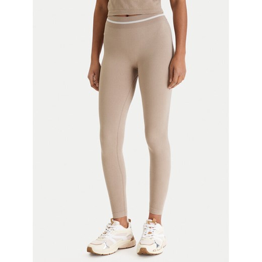 Guess Legginsy V6RB05 Z4692 Beżowy Slim Fit ze sklepu MODIVO w kategorii Spodnie damskie - zdjęcie 188427783
