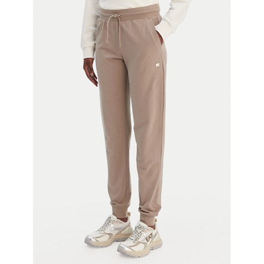 EA7 Emporio Armani Spodnie dresowe 7W000461 AF13135 U6167 Beżowy Regular Fit ze sklepu MODIVO w kategorii Spodnie damskie - zdjęcie 188868991
