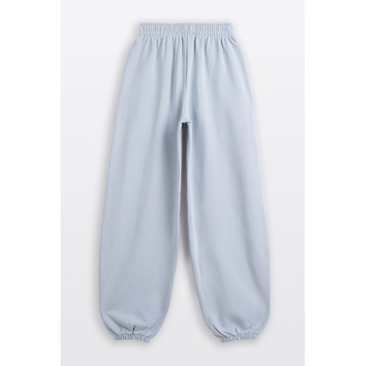 Jasnoniebieskie spodnie dresowe OVERSIZE bez nadruków, Rozmiar - 146, Kolor - Niebieski ze sklepu REPORTER w kategorii Spodnie dziewczęce - zdjęcie 189110992