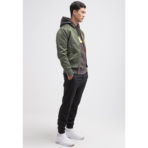 Nike Sportswear Spodnie materiałowe black zalando czarny bez wzorów/nadruków