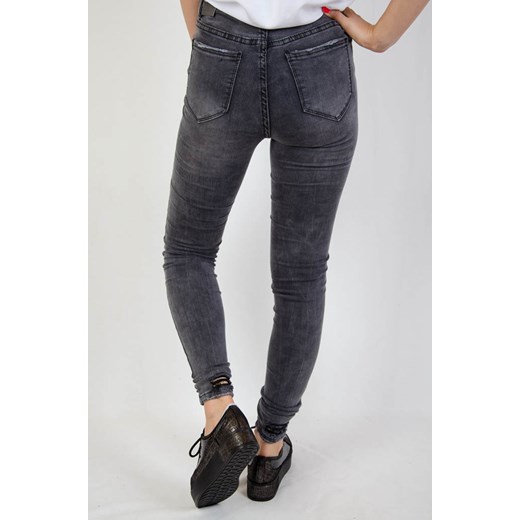 Szare spodnie jeansowe z szarpaniem na nogawce   M olika.com.pl