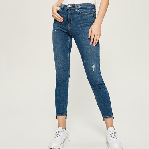 Sinsay - Jeansy skinny z przetarciami - Niebieski  Sinsay 34 