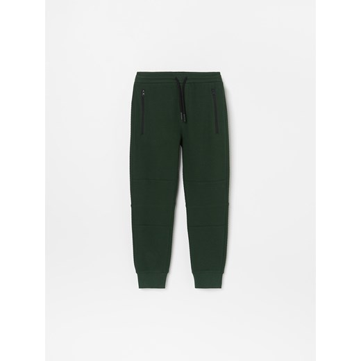 Spodnie chłopięce zielone Reserved jesienne bez wzorów 