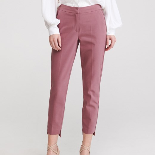 Reserved - Spodnie z asymetrycznymi nogawkami - Różowy Reserved  42 