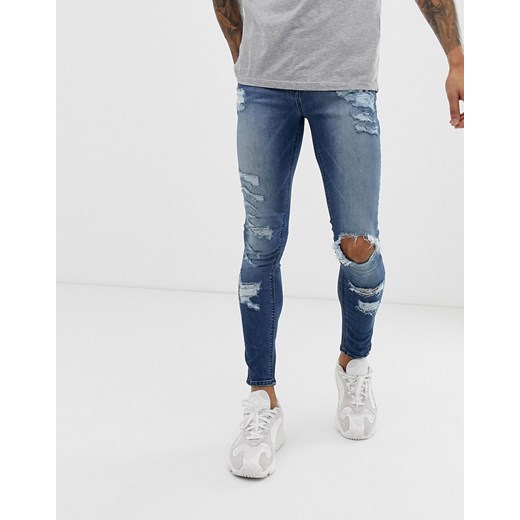 ASOS DESIGN – Niebieskie bardzo obcisłe jeansy ze stretchem z przetarciami