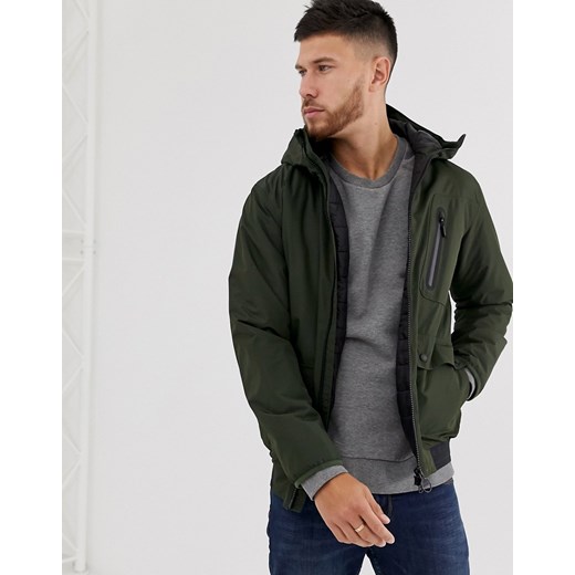 Barbour International Lane – Wodoszczelna kurtka w kolorze khaki wykończona z tyłu elastycznym paskiem z logo-Zielony