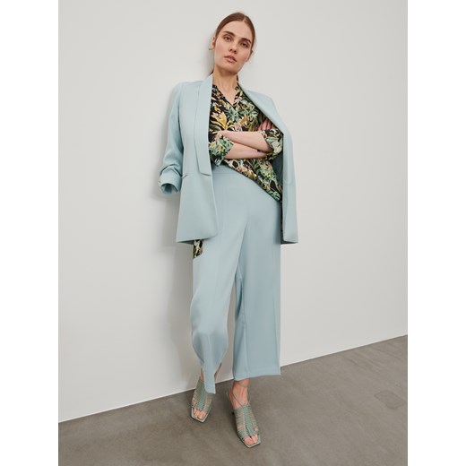 Bluzka damska Reserved w kwiaty z dekoltem v