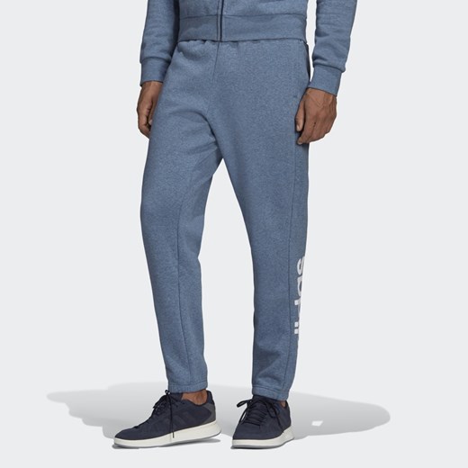 Spodnie męskie niebieskie Adidas z napisami 