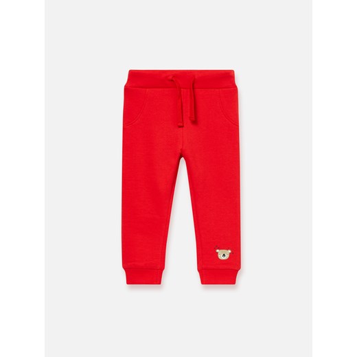 Sinsay - Spodnie dresowe z nadrukiem - Czerwony Sinsay  74 