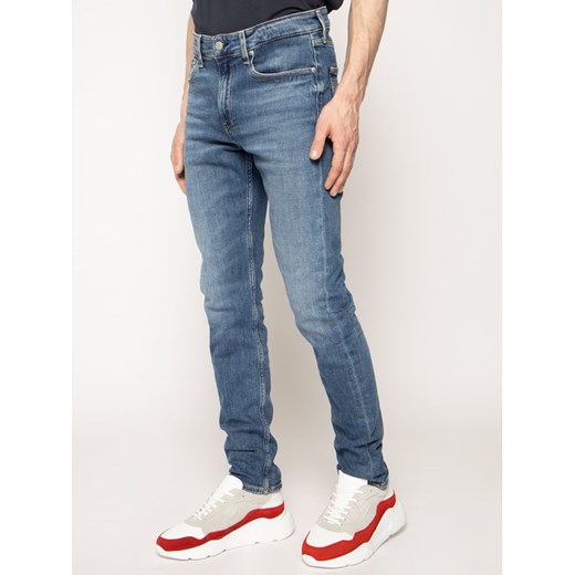 Calvin Klein Jeans Jeansy Slim Fit J30J314616 Niebieski Slim Taper Fit 32_34 promocja MODIVO