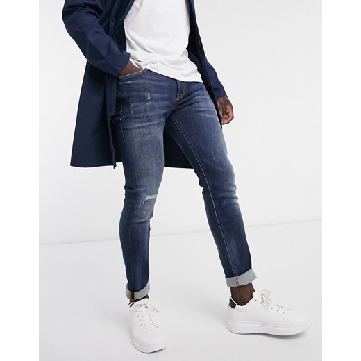 Calvin Klein Jeans – Niebieskie jeansy o obcisłym kroju z efektem sprania i znoszenia 30" Short Asos Poland