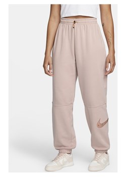 Joggery z wysokim stanem Nike Sportswear Swoosh - Różowy ze sklepu Nike poland w kategorii Spodnie damskie - zdjęcie 128366280