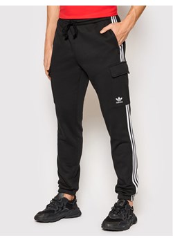 adidas Spodnie dresowe adicolor Classics 3-Stripes HG4829 Czarny Slim Fit ze sklepu MODIVO w kategorii Spodnie męskie - zdjęcie 134311903