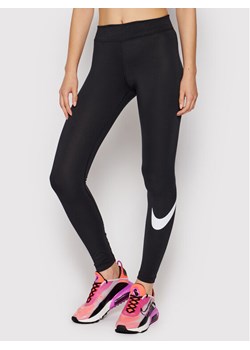 Nike Legginsy Sportswear Essential CZ8530 Czarny Slim Fit ze sklepu MODIVO w kategorii Spodnie damskie - zdjęcie 134332361