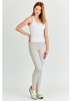 GUESS - Beżowe legginsy damskie w białe logo ze sklepu outfit.pl w kategorii Spodnie damskie - zdjęcie 139827274