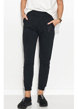 Dresowe spodnie damskie z prostą nogawką M732, Kolor czarny, Rozmiar S/M, Makadamia ze sklepu Primodo w kategorii Spodnie damskie - zdjęcie 141918043