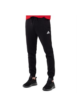 Spodnie adidas Essentials Fleece Regular Tapered HL2236 - czarne ze sklepu streetstyle24.pl w kategorii Spodnie męskie - zdjęcie 144512251