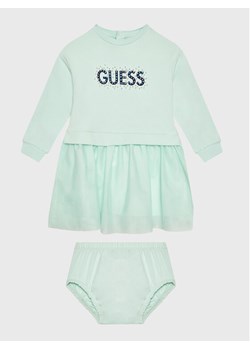 Guess Sukienka elegancka A3RK08 KA6V0 Zielony Regular Fit ze sklepu MODIVO w kategorii Odzież dla niemowląt - zdjęcie 150236552