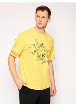 Puma T-Shirt MICHAEL LAU 2Sho Tee 530361 Żółty Regular Fit ze sklepu MODIVO w kategorii T-shirty męskie - zdjęcie 150454061