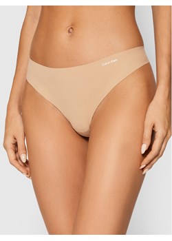 Calvin Klein Underwear Stringi 0000D3428E Beżowy ze sklepu MODIVO w kategorii Majtki damskie - zdjęcie 150536831