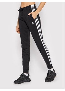 adidas Spodnie dresowe 3-Stripes GM8733 Czarny Slim Fit ze sklepu MODIVO w kategorii Spodnie damskie - zdjęcie 152536834