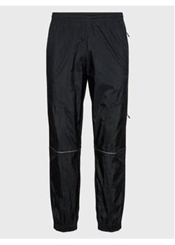 adidas Spodnie dresowe Reveal Material Mix HK2732 Czarny Regular Fit ze sklepu MODIVO w kategorii Spodnie męskie - zdjęcie 152611900