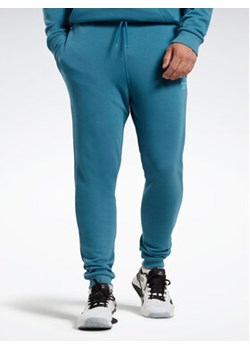 Reebok Spodnie dresowe Reebok Identity French Terry Joggers H49680 Niebieski Regular Fit ze sklepu MODIVO w kategorii Spodnie męskie - zdjęcie 152944743
