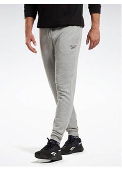 Reebok Spodnie dresowe Reebok Identity French Terry Joggers HZ8785 Szary Regular Fit ze sklepu MODIVO w kategorii Spodnie męskie - zdjęcie 153524502