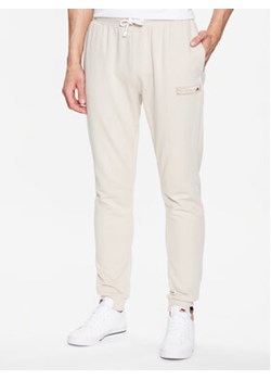 Ellesse Spodnie dresowe Coperchiata SHR17563 Beżowy Regular Fit ze sklepu MODIVO w kategorii Spodnie męskie - zdjęcie 156150160