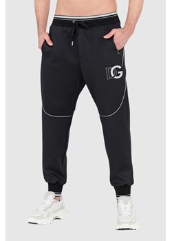 DOLCE & GABBANA - Czarne spodnie dresowe z dużym logo ze sklepu outfit.pl w kategorii Spodnie męskie - zdjęcie 156835080