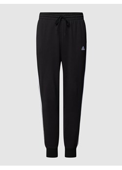 Spodnie dresowe PLUS SIZE z wyhaftowanym logo ze sklepu Peek&Cloppenburg  w kategorii Spodnie damskie - zdjęcie 158666631