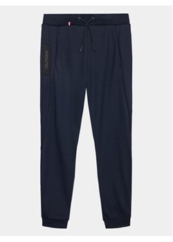 Tommy Hilfiger Spodnie dresowe KS0KS00504 D Granatowy Regular Fit ze sklepu MODIVO w kategorii Spodnie chłopięce - zdjęcie 159319321