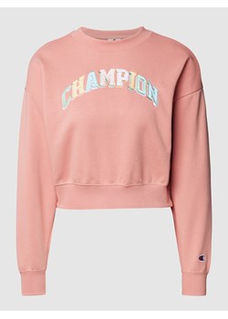 Bluza krótka z napisem z logo z błyszczącym efektem ze sklepu Peek&Cloppenburg  w kategorii Bluzy damskie - zdjęcie 160612613