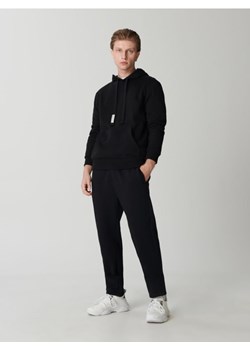 Sinsay - Spodnie dresowe jogger - czarny ze sklepu Sinsay w kategorii Spodnie męskie - zdjęcie 161209230