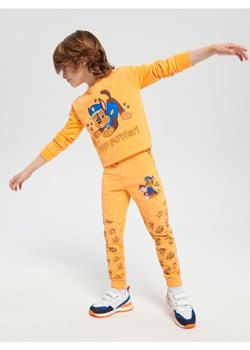 Sinsay - Spodnie dresowe jogger Psi Patrol - pomarańczowy ze sklepu Sinsay w kategorii Spodnie chłopięce - zdjęcie 161213840