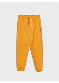 Sinsay - Spodnie dresowe jogger - żółty ze sklepu Sinsay w kategorii Spodnie chłopięce - zdjęcie 161215184