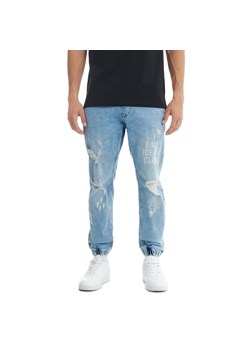 Cropp - Niebieskie jeansy jogger z postrzępieniami - niebieski ze sklepu Cropp w kategorii Jeansy męskie - zdjęcie 161363610