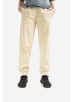 The North Face spodnie dresowe bawełniane Oversized Jogger kolor beżowy gładkie NF0A5IGE-3X4 ze sklepu PRM w kategorii Spodnie damskie - zdjęcie 161400692