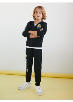 Sinsay - Spodnie dresowe jogger Minionki - czarny ze sklepu Sinsay w kategorii Spodnie chłopięce - zdjęcie 161471111