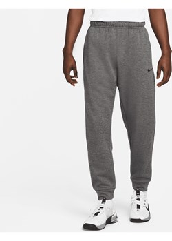 Męskie zwężane spodnie do fitnessu Therma-FIT Nike Therma - Szary ze sklepu Nike poland w kategorii Spodnie męskie - zdjęcie 161523231