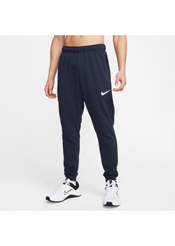 Męskie zwężane spodnie do fitnessu z dzianiny Dri-FIT Nike Dry - Niebieski ze sklepu Nike poland w kategorii Spodnie męskie - zdjęcie 161527874