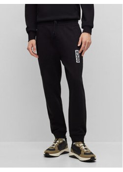 Hugo Spodnie dresowe Dogur 50494179 Czarny Relaxed Fit ze sklepu MODIVO w kategorii Spodnie męskie - zdjęcie 161957144