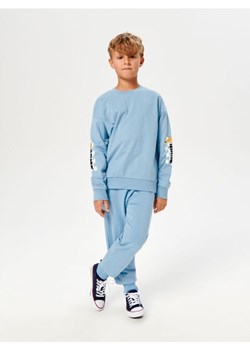 Sinsay - Spodnie dresowe jogger Looney Tunes - niebieski ze sklepu Sinsay w kategorii Spodnie chłopięce - zdjęcie 162268364