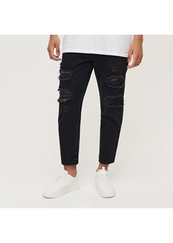 Czarne jeansy loose fit z przetarciami - Czarny ze sklepu House w kategorii Jeansy męskie - zdjęcie 162502011