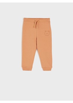 Sinsay - Spodnie dresowe jogger - pomarańczowy ze sklepu Sinsay w kategorii Spodnie i półśpiochy - zdjęcie 162512841