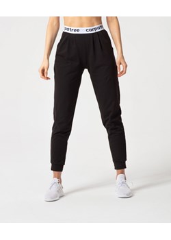 Damskie spodnie dresowe Carpatree Lucky - czarne ze sklepu Sportstylestory.com w kategorii Spodnie damskie - zdjęcie 163424993