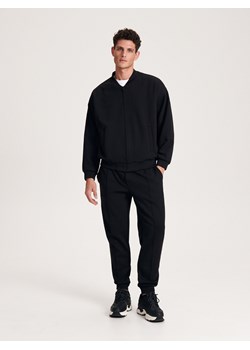 Reserved - Spodnie jogger slim - czarny ze sklepu Reserved w kategorii Spodnie męskie - zdjęcie 163477542